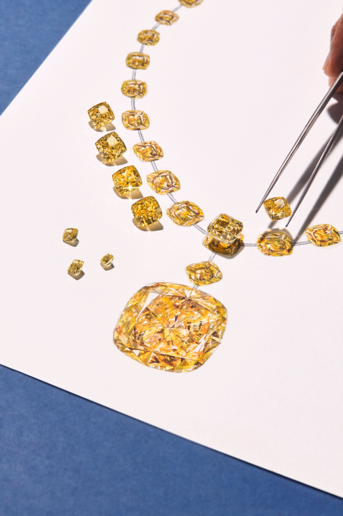 Grayscale image of diamonds being arranged with tweezers on a surface.
