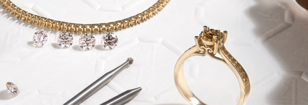 Vector graphic depicting a diamond necklace and ring with loose stones.